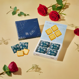 Ishiya Shiroi Koibito cookies elegantly arranged with snowy Hokkaido mountains in the background a perfect white chocolate gift from Japan
