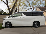 Side view of Toyota Vellfire – spacious and elegant minivan rental for group travel in Hokkaido