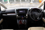 Driver seat and dashboard of Toyota Vellfire – high-end interior for luxury rental car in Hokkaido