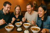foreign tourist enjoying Spicy Japanese Soup Curry at a popular Sapporo restaurant